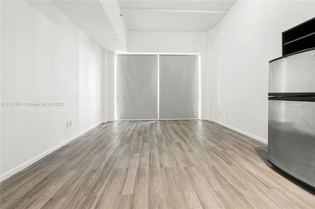 unfurnished living room with light hardwood / wood-style floors