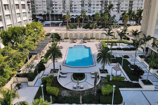 view of swimming pool featuring a patio area