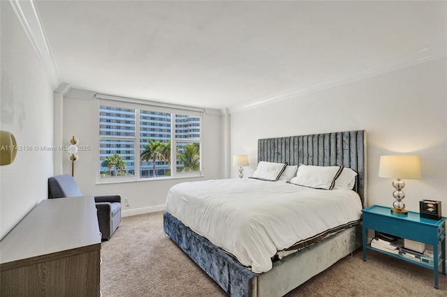 bedroom with crown molding and carpet floors