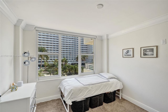 bedroom featuring crown molding and carpet flooring