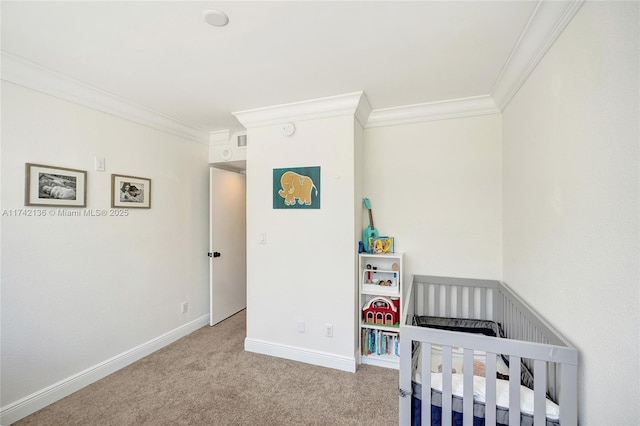 carpeted bedroom featuring ornamental molding and a nursery area