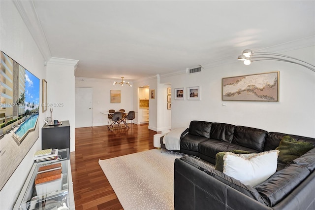 living room featuring crown molding and dark hardwood / wood-style floors