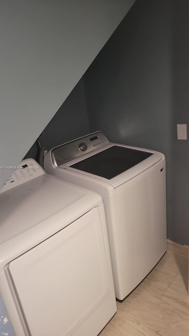 washroom with washing machine and dryer