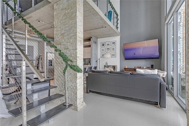 living room with a high ceiling