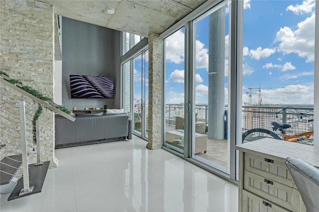 interior space featuring tile patterned floors and a wall of windows