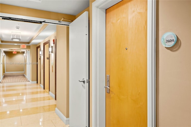 hallway with light tile patterned floors