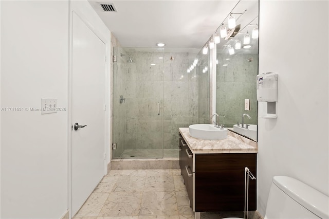 bathroom with vanity, toilet, and walk in shower