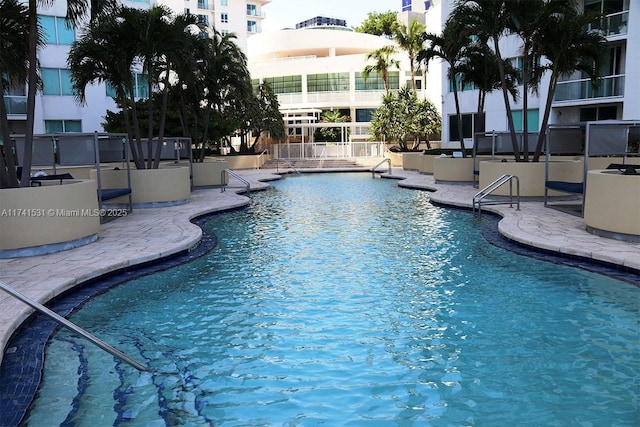 view of swimming pool with a patio