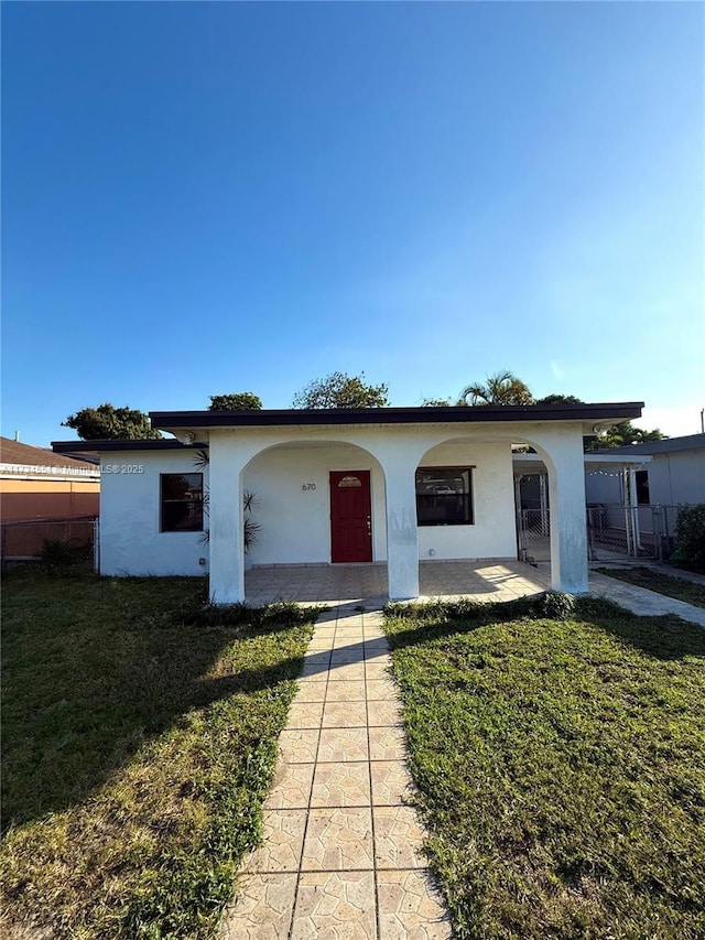 view of front of property with a front lawn