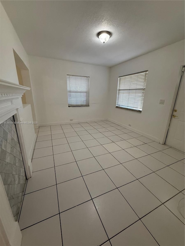 spare room with a textured ceiling