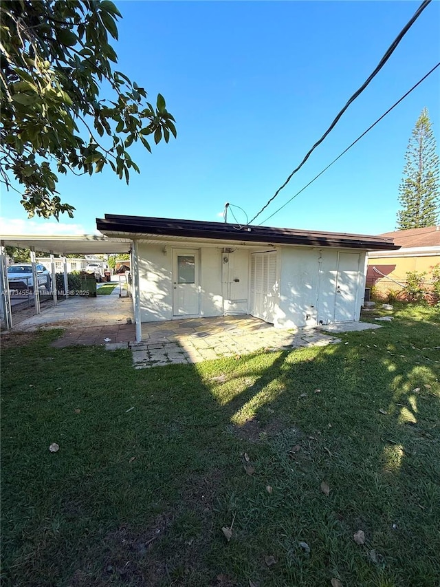 rear view of house with a lawn