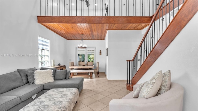 tiled living room with a notable chandelier and wood ceiling