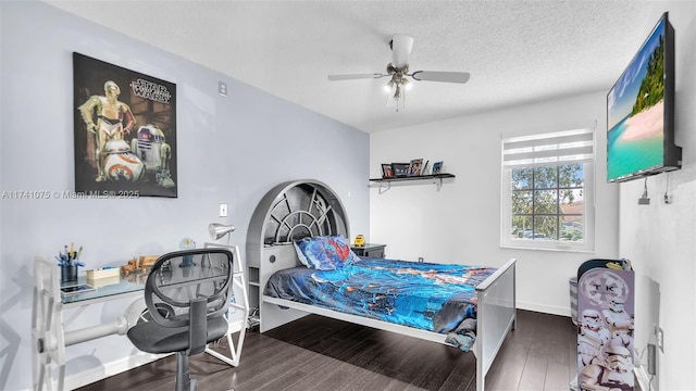 bedroom featuring ceiling fan, dark hardwood / wood-style floors, and a textured ceiling