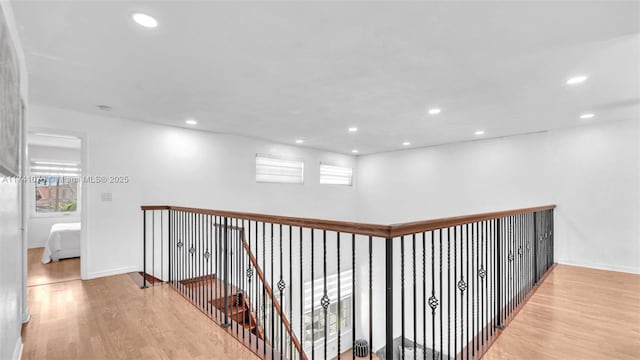 corridor with light hardwood / wood-style flooring