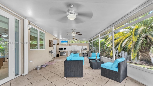 sunroom / solarium with ceiling fan