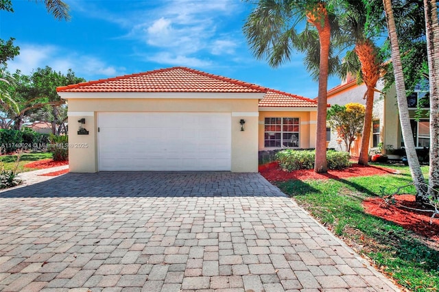 mediterranean / spanish-style home featuring a garage