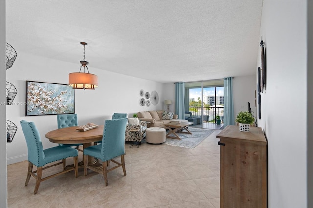 dining space featuring a textured ceiling