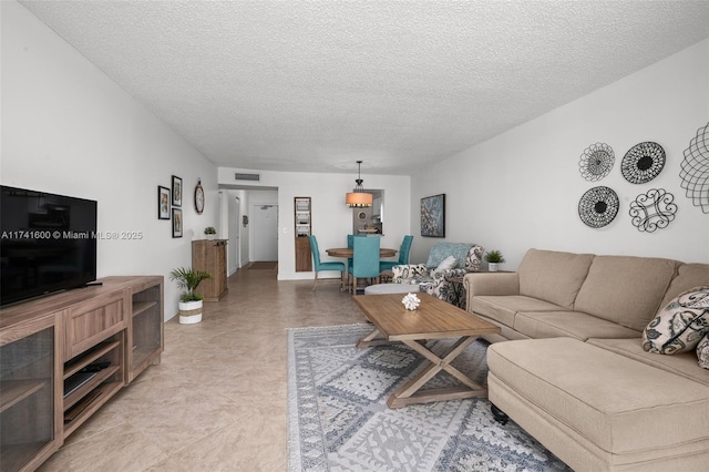 living room featuring a textured ceiling