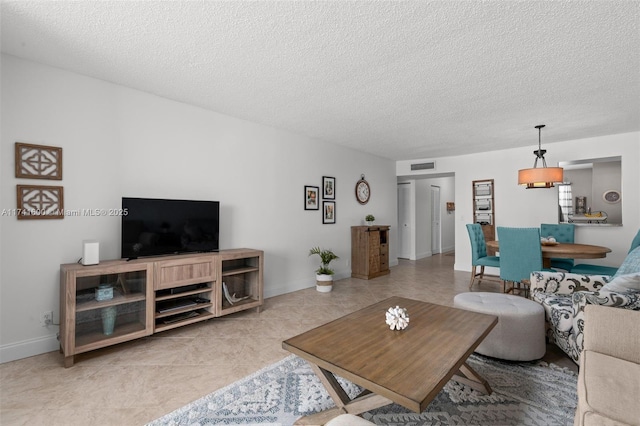 living room with a textured ceiling