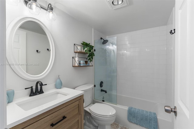 full bathroom with vanity, toilet, and tiled shower / bath