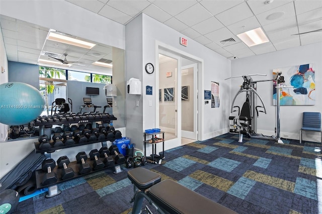 exercise room with a drop ceiling