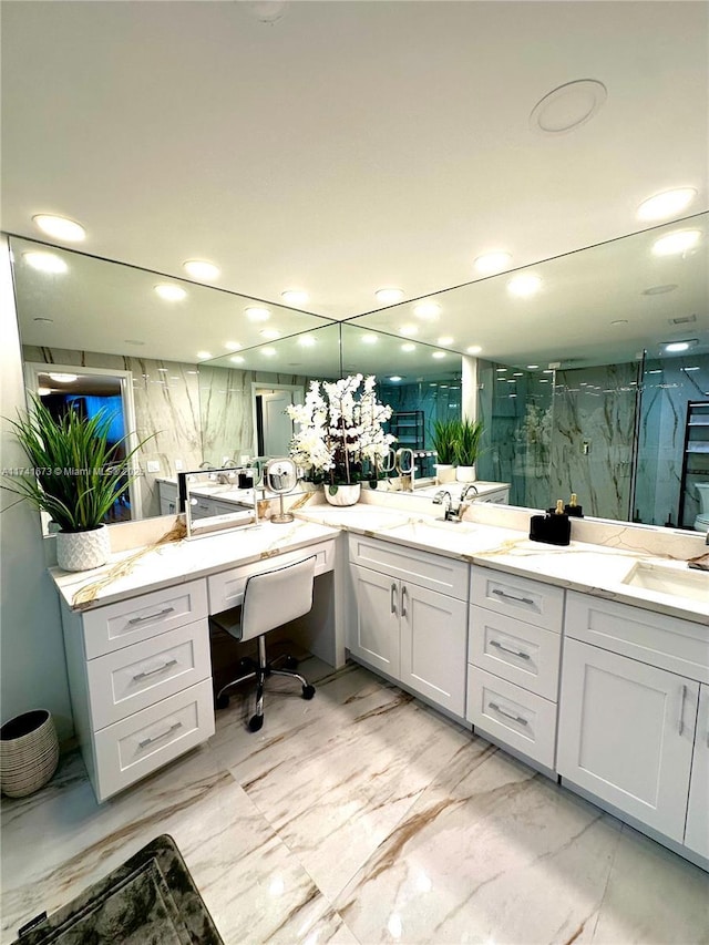 bathroom featuring walk in shower and vanity