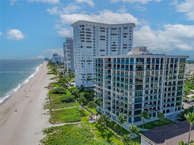 bird's eye view featuring a beach view and a water view