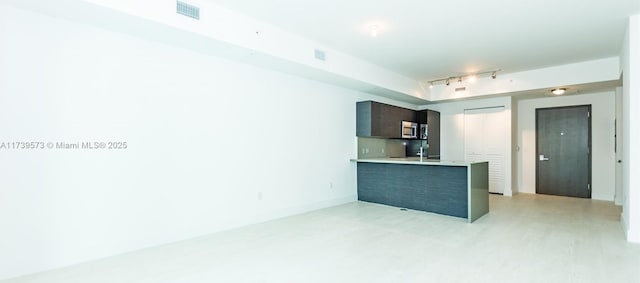 kitchen with track lighting and kitchen peninsula