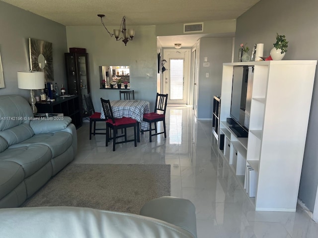 living room featuring an inviting chandelier