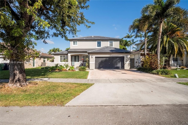 view of front facade featuring a garage and a front yard