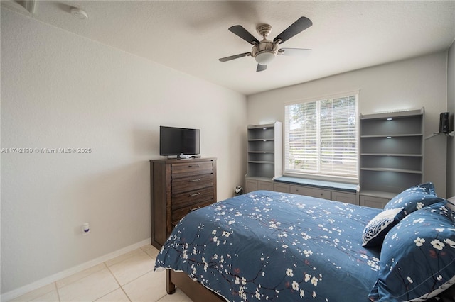 tiled bedroom featuring ceiling fan