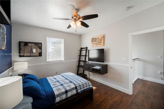 bedroom featuring dark hardwood / wood-style flooring and ceiling fan