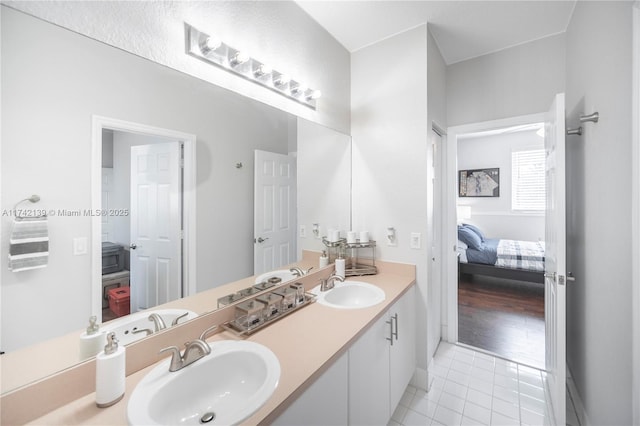 bathroom featuring tile patterned flooring and vanity