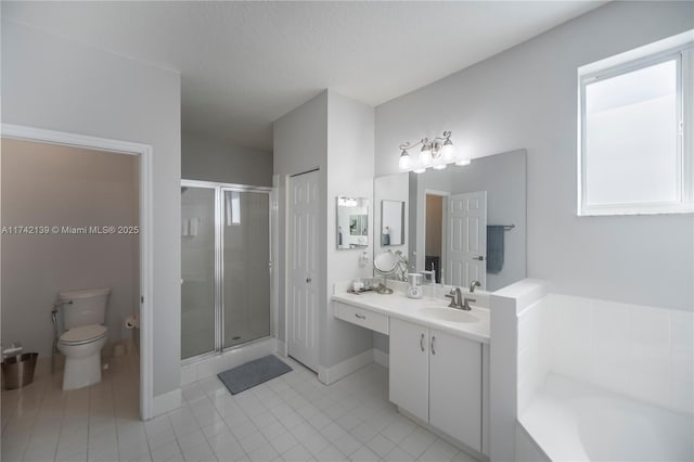 full bathroom with vanity, a textured ceiling, plus walk in shower, and toilet