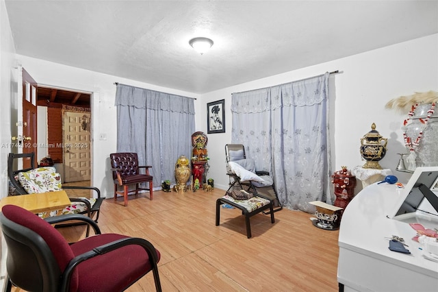 sitting room featuring wood-type flooring