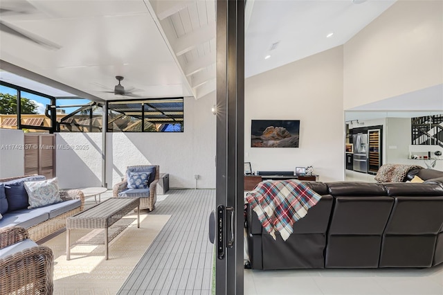 interior space featuring an outdoor hangout area and ceiling fan