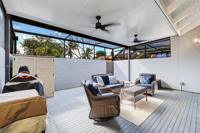 wooden terrace featuring area for grilling, outdoor lounge area, and ceiling fan