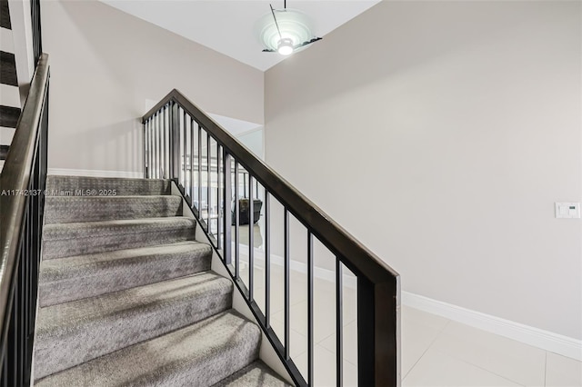 stairs with tile patterned flooring