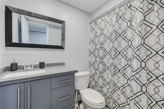 bathroom featuring vanity, a shower with curtain, and toilet