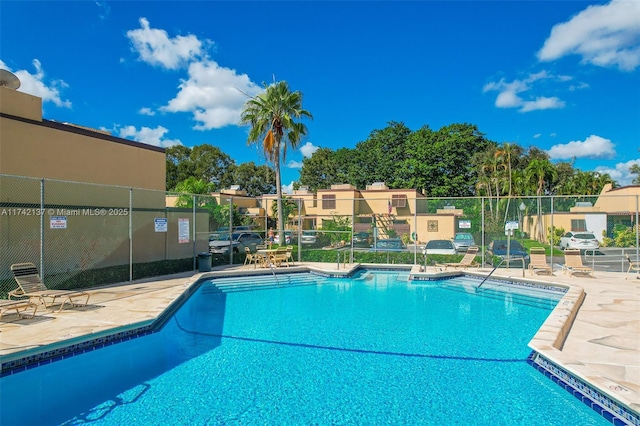 view of swimming pool featuring a patio area