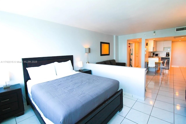 bedroom featuring light tile patterned floors