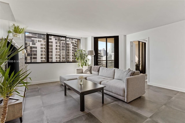 540 Brickell Key Dr Unit 1519, Miami, FL 33131 - living area featuring baseboards and concrete floors
