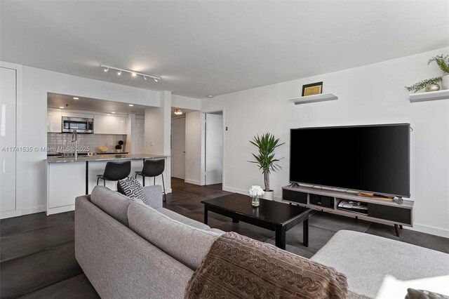 540 Brickell Key Dr Unit 1519, Miami, FL 33131 - living room featuring baseboards