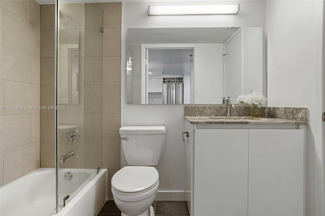 full bathroom featuring vanity, toilet, and tiled shower / bath combo