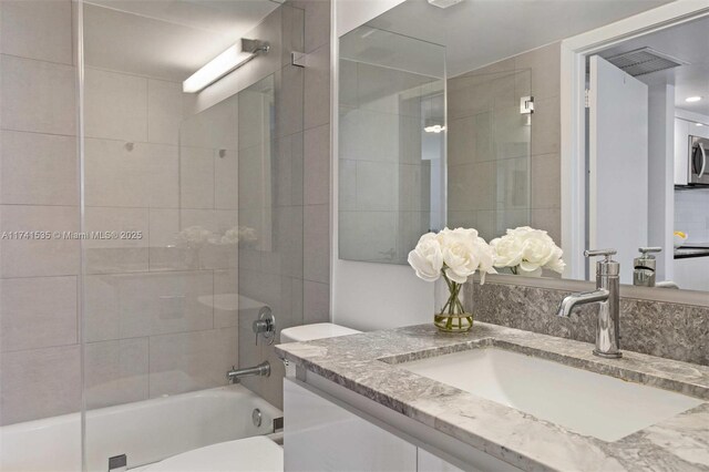 540 Brickell Key Dr Unit 1519, Miami, FL 33131 - bathroom featuring shower / bath combination, visible vents, toilet, and vanity