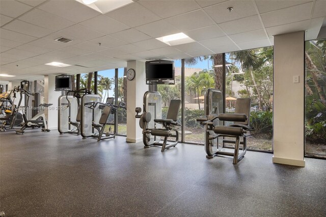540 Brickell Key Dr Unit 1519, Miami, FL 33131 - workout area with visible vents, floor to ceiling windows, baseboards, and a paneled ceiling