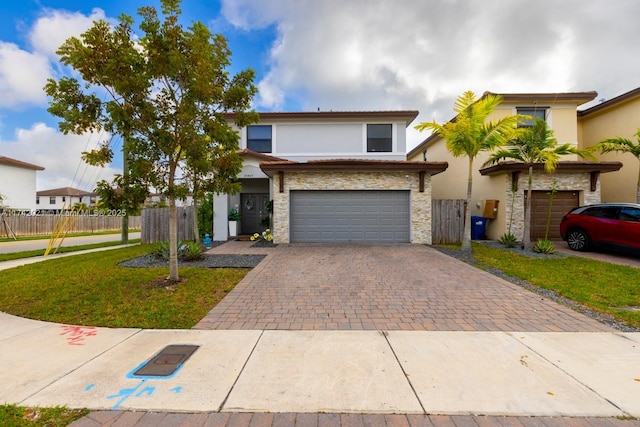 view of front facade featuring a garage and a front yard