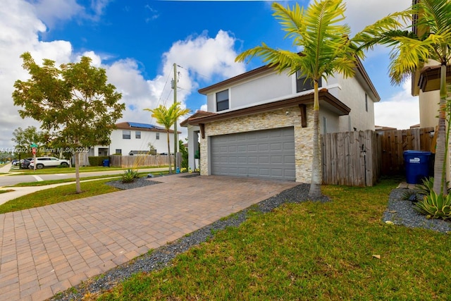 view of front facade with a garage and a front yard