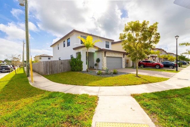 view of front of house with a garage and a front yard