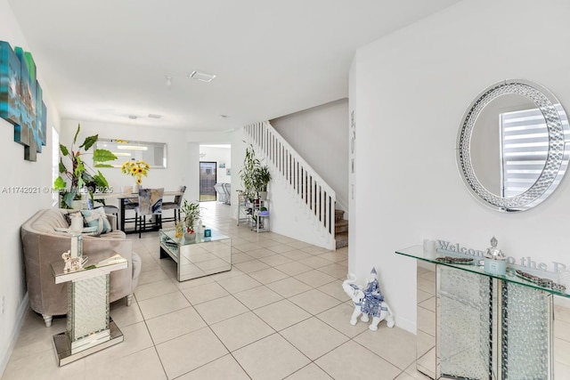 interior space featuring a healthy amount of sunlight and light tile patterned floors